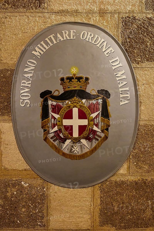 Emblem of the Sovereign Order of Malta on a stone wall, interior view, Grand Master's Palace, Knights' Town, Rhodes Town, Rhodes, Dodecanese, Greek Islands, Greece, Europe