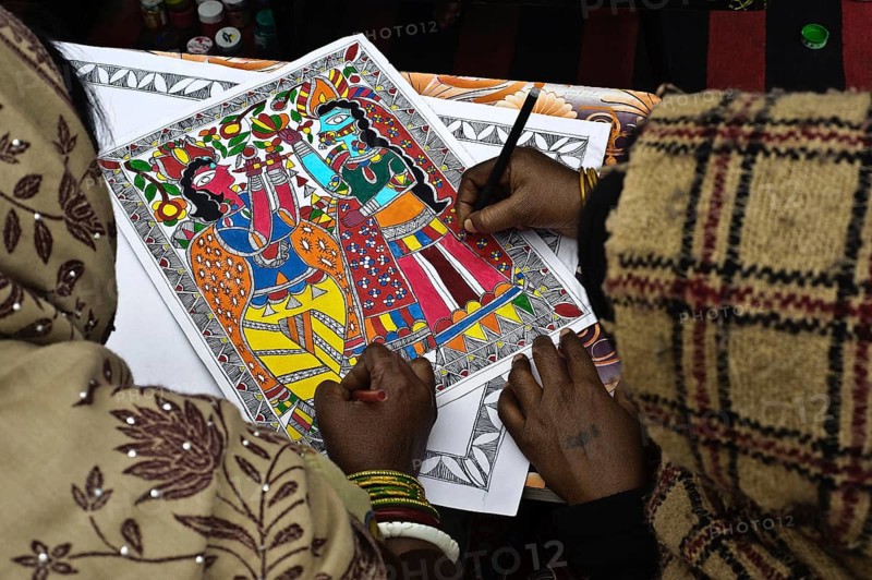 Women taking drawing lessons in a drawing school, learning the Madhubani style of painting, Bihar, India, Asia