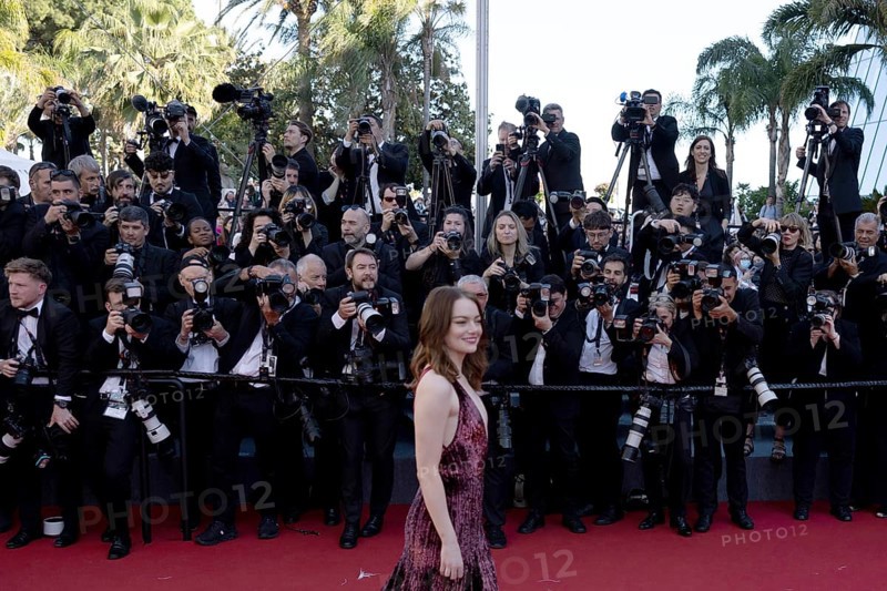 Cannes, France, 17.5.2024: Emma Stone and photographers at the premiere of Kinds of Kindness on the red carpet of the Palais des Festivals during the 77th Cannes International Film Festival. The 77th Cannes International Film Festival will take place from 14 to 25 May 2024, Europe