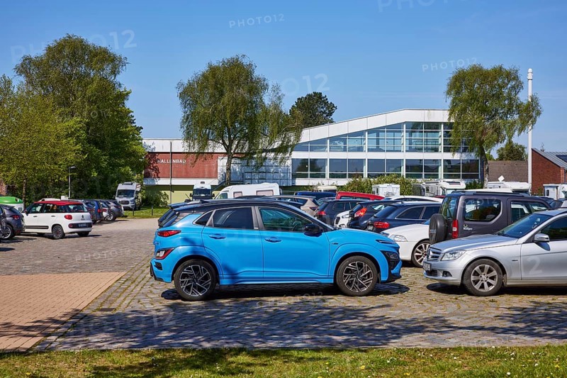 Indoor swimming pool with car park in Niebuell, Nordfriesland district, Schleswig-Holstein, Germany, Europe
