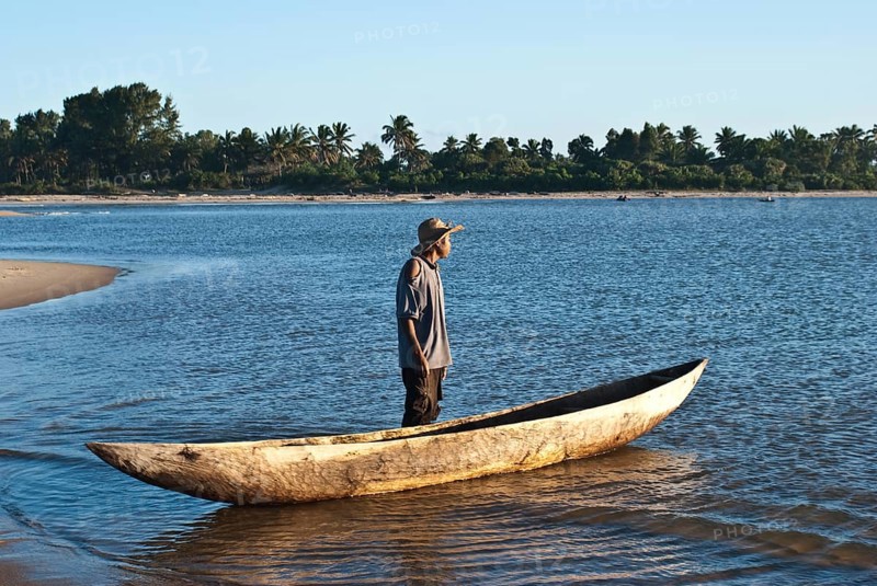 Pirogue and boatman, Pangalanes canal, Madagascar, Africa