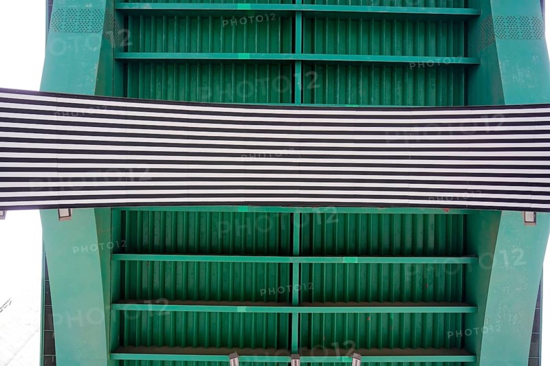 La Salve Bridge, underside of a bridge with green metal structure and striped banner, Old Town, Bilbao, Basque Country, Spain, Europe