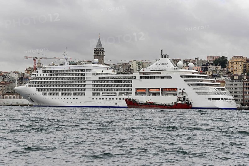Cruise ship SILVERSEA, against the backdrop of Istanbul and the Galata Tower on a cloudy day, Istanbul, Istanbul province, Turkey, Asia