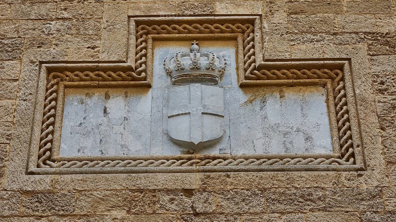 Weathered stone relief of a crowned coat of arms in a wall niche, Grand Master's Palace, Knights' Town, Rhodes Town, Rhodes, Dodecanese, Greek Islands, Greece, Europe