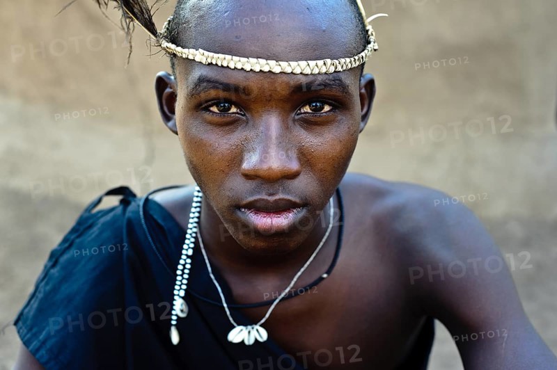 Portrait of a teenage boy following his initiation rite, teen from the Njemps tribe, Kenya. Once finished, he will be considered as a warrior