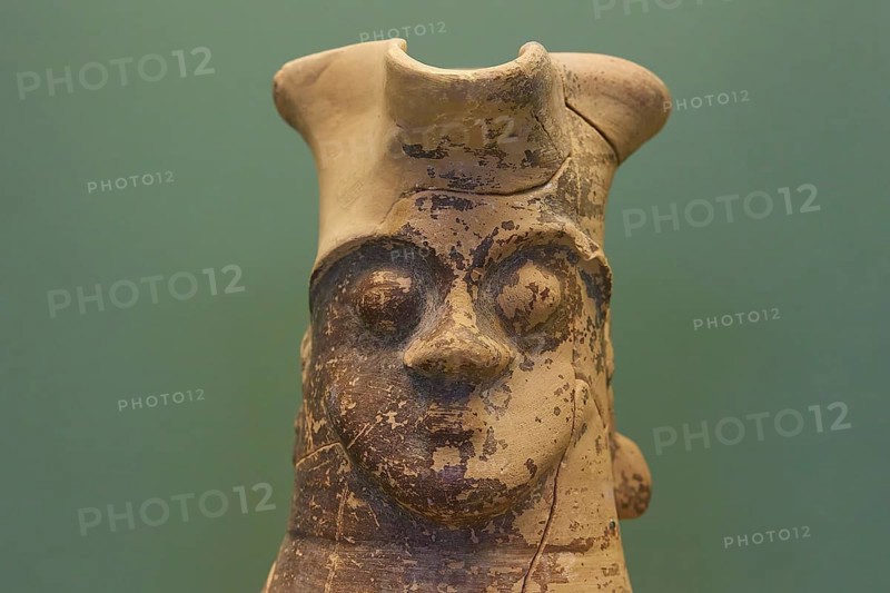 Large antique sculpture of a face with faded colours against a green background, interiors, Archaeological Museum, Old Town, Rhodes Town, Rhodes, Dodecanese, Greek Islands, Greece, Europe
