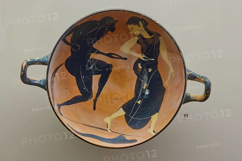 A satyr and a maenad dancing, Greek bowl with a mythological scene painted in black on an orange background, interiors, Archaeological Museum, Old Town, Rhodes Town, Rhodes, Dodecanese, Greek Islands, Greece, Europe