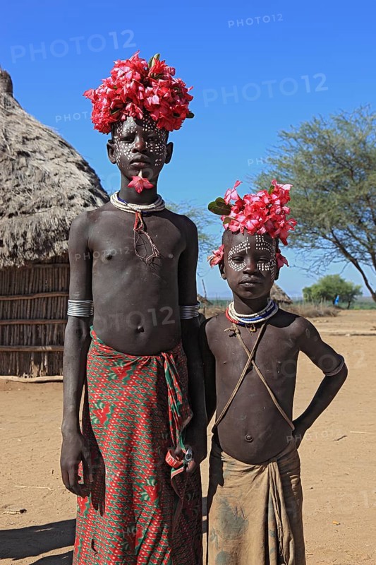 South Ethiopia, Omo region, tribal members of the Karo people, with floral decorations and body painting, Ethiopia, Africa
