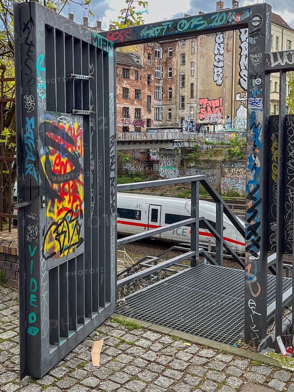 Germany, Berlin, 26.04.2024, S-Bahn ring railway trench, open service gate, ICE, view to Schoenfliesser Bruecke, (rear building) gable of Kopenhagener Strasse, Europe