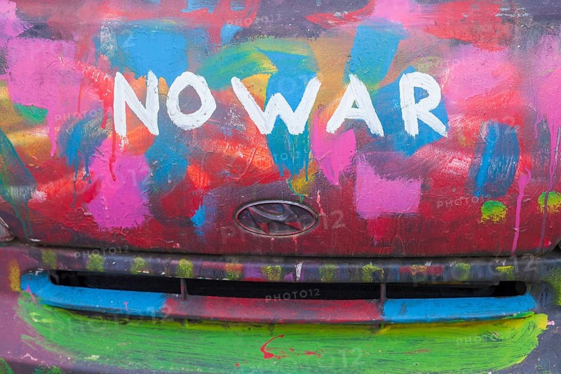 Lettering No War, kein Krieg, colourfully painted vintage car, colour surface, Germany, Europe
