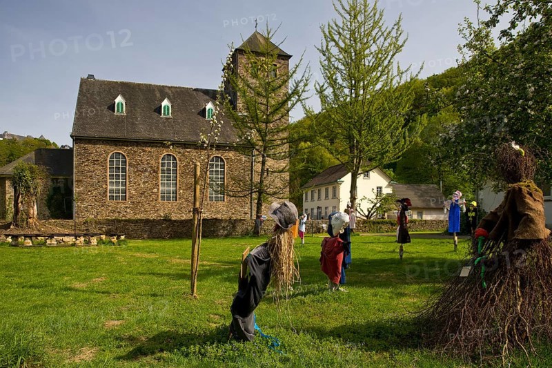 Scarecrows at the Protestant church in Unterburg, Solingen, Bergisches Land, North Rhine-Westphalia