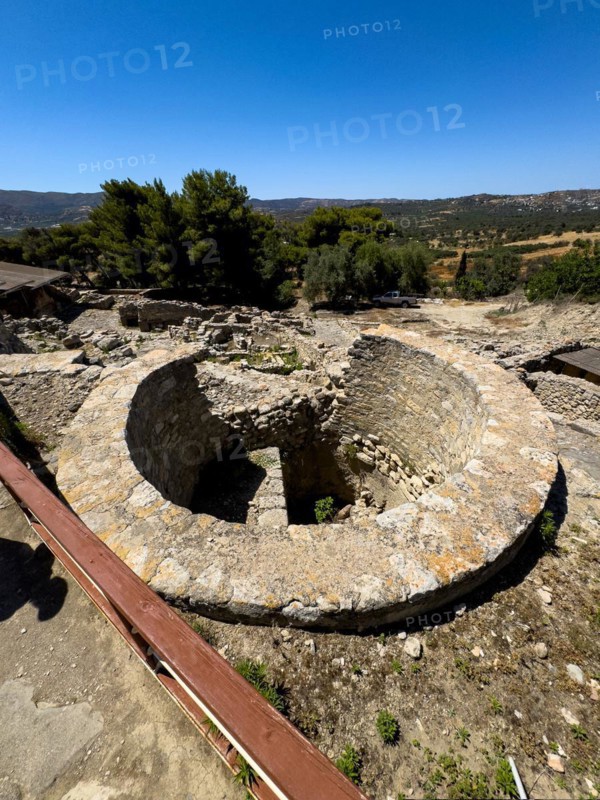 View of Kouloures Ring in earth embedded large walled round storage container in area of Old Palace in archaeological site of Minoan culture of pre-Greek ancient Greek people Minoans, Phaistos Hill, Kamilari, Crete, Greece, Europe