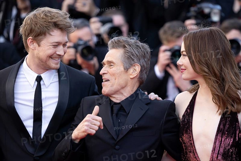 Cannes, France, 17.5.2024: Joe Alwynbei, Willem Dafoe and Emma Stone at the premiere of Kinds of Kindness on the red carpet of the Palais des Festivals during the 77th Cannes International Film Festival. The 77th Cannes International Film Festival will take place from 14 to 25 May 2024, Europe