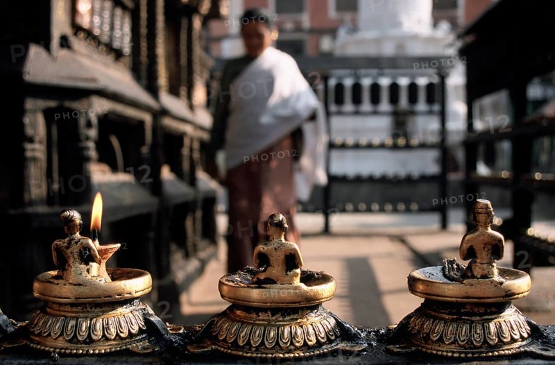 Newari woman walking around a Newari temple, Harati temple, Kathmandu valley, Nepal. Newar are the original inhabitants of tThey have their own culture, their own religion