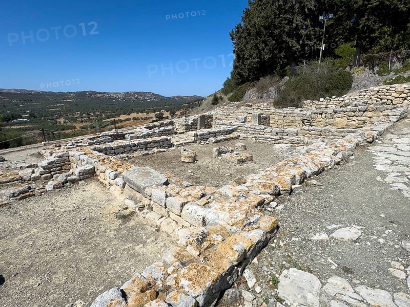 Foundation walls of ancient Roman building with assembly room with columned architecture from Roman times 1st century BC on north-western square In archaeological site on hill of Phaistos of Minoan culture pre-Greek ancient Greek people Minoans in antiquity, Kamilari, Crete, Greece, Europe