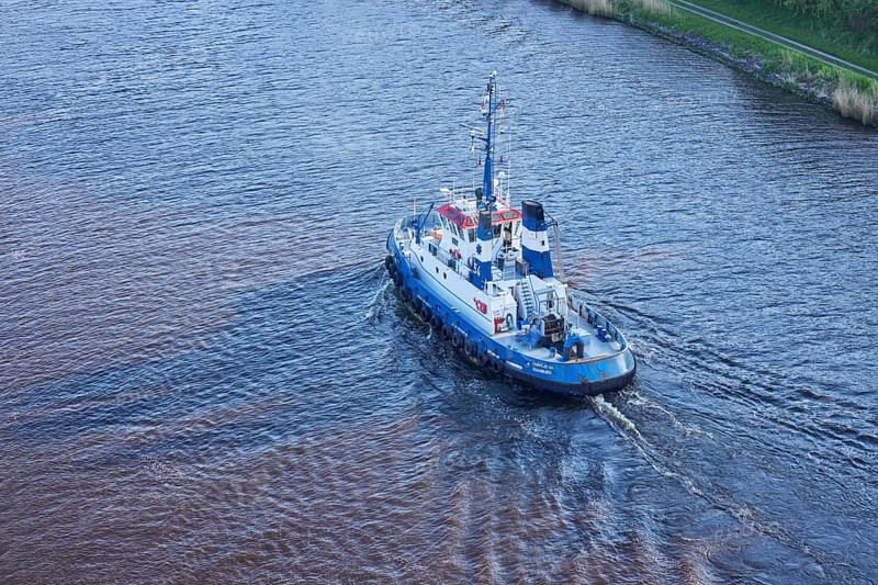 Bird's eye view of the Fairplay-54 tugboat on the Kiel Canal near Beldorf, Rendsburg-Eckernfoerde district, Schleswig-Holstein, Germany, Europe
