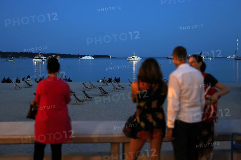 Cannes, France, 13 May 2024: People look out over the Cote d'Azur on the Boulevard de la Croisette on the eve of the opening of the festival. The 77th Cannes International Film Festival will take place from 14 to 25 May 2024, Europe