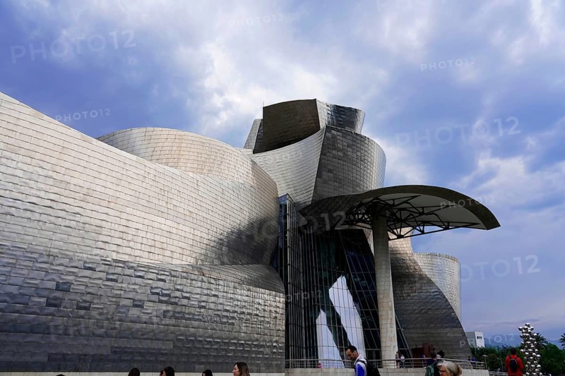 Guggenheim Museum, Bilbao, Basque Country, Spain, Europe, A modern building with a unique architectural structure under a cloudy sky, Guggenheim Museum Bilbao on the banks of the river Nervion, architect Frank O. Gehry, Europe