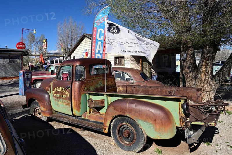 Old, rusty cars in the backyard of Delgadillo's Snow Cap Drive Inn on Route 66, Seligman, Arizona