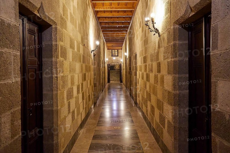 Long corridor with symmetrical stone walls and lighting, interior view, Grand Master's Palace, Knights' Town, Rhodes Town, Rhodes, Dodecanese, Greek Islands, Greece, Europe