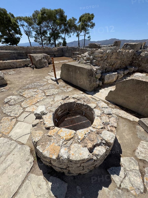 Historical shaft in ground from antiquity In archaeological site of Minoan culture of pre-Greek ancient Greek people Minoans, section of palace of Phaistos with so-called royal apartments Royal Apartments, hill of Phaistos, Kamilari, Crete, Greece, Europe