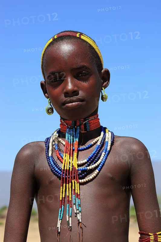 South Ethiopia, in a village of the Arbore or Erbore people at Lake Stefano, girl with headdress and necklaces, Ethiopia, Africa
