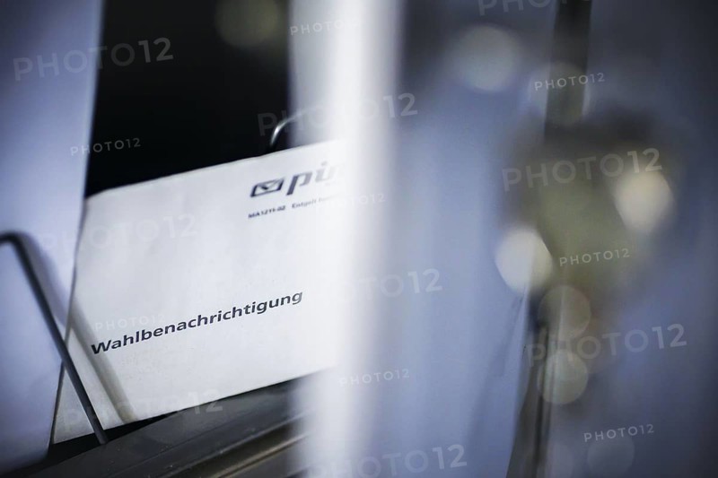 Symbolic photo: A polling card lying in a letterbox. Berlin, 14 May 2024