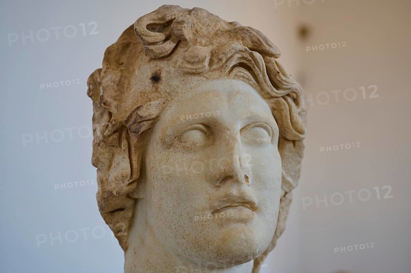 Helios, Sun God, Ancient marble sculpture of a damaged head with curly hair and pensive expression, Interiors, Archaeological Museum, Old Town, Rhodes Town, Rhodes, Dodecanese, Greek Islands, Greece, Europe