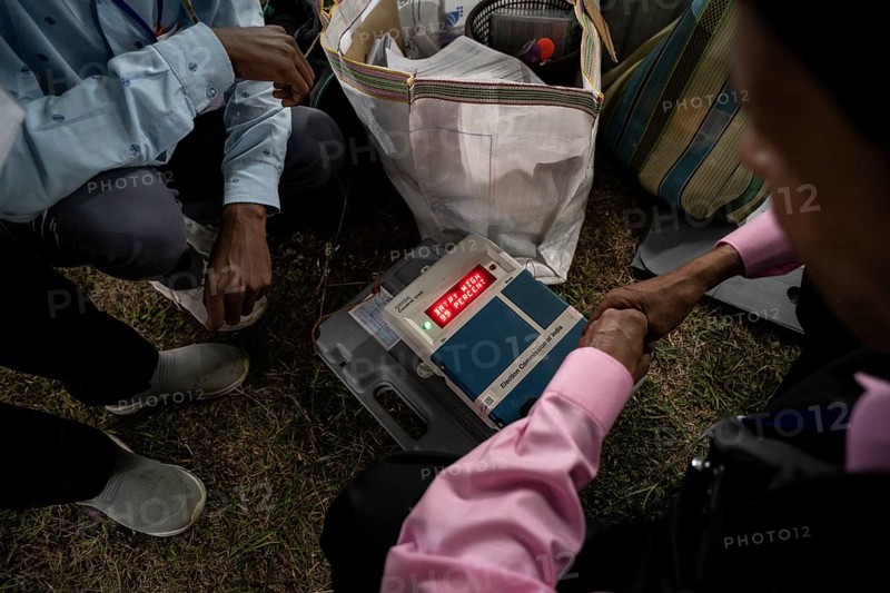 Barpeta, India. 6 May 2024. Polling officials check Electronic Voting Machines (EVMs) before leaving for allocated polling station, on the eve of the third phase of General Election on May 6, 2024 in Barpeta, India, Asia