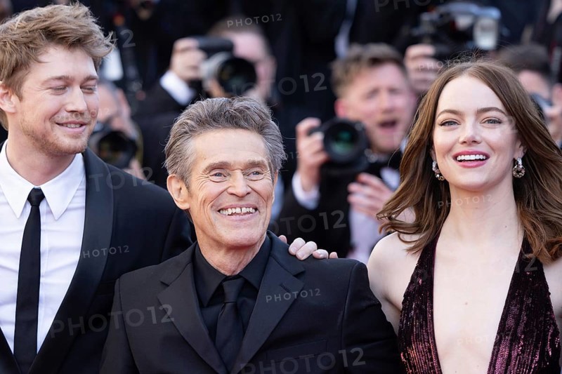 Cannes, France, 17.5.2024: Joe Alwynbei, Willem Dafoe and Emma Stone at the premiere of Kinds of Kindness on the red carpet of the Palais des Festivals during the 77th Cannes International Film Festival. The 77th Cannes International Film Festival will take place from 14 to 25 May 2024, Europe