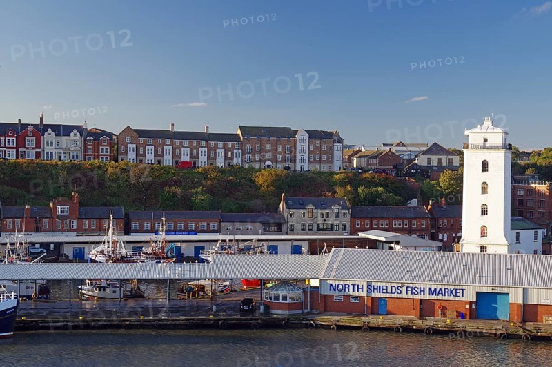 Residential houses, lighthouse and old warehouses at the harbour of Tynemouth, ferry trip Amsterdam to Newcastle, England, Great Britain
