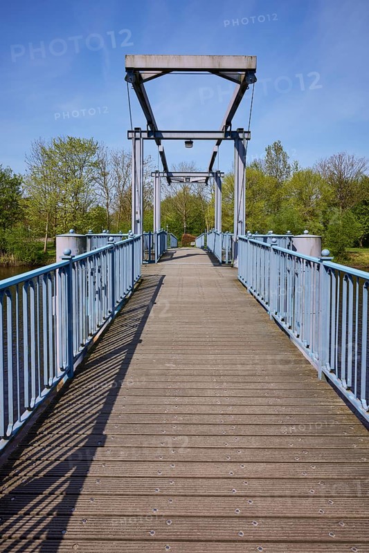 Blue bridge over the Westersielzug in Friedrichstadt, district of Nordfriesland, Schleswig-Holstein, Germany, Europe