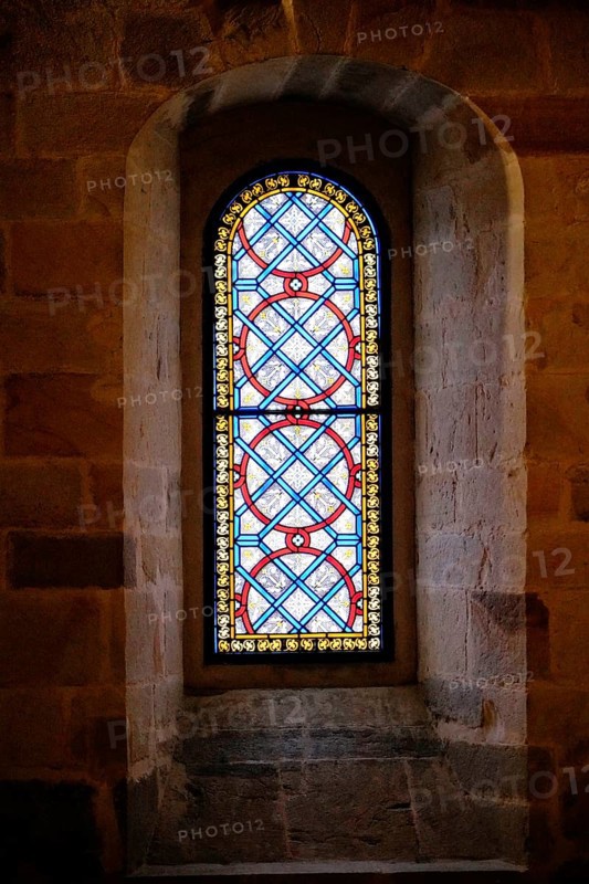 The Iglesia de San Anton church on the Nervion river in Bilbao, A colourful church window with complex patterns in blue, red and yellow, The Iglesia de San Anton church on the Nervion river in Bilbao. Built in 1510, the church is a Catholic place of worship in the historic city centre. It is built in the Gothic style with Baroque elements, BILBAO, Spain, Europe