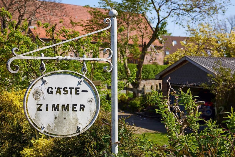 Old sign for guest rooms in Niebuell, district of Nordfriesland, Schleswig-Holstein, Germany, Europe