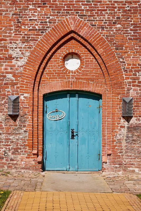 Entrance door to St Laurentius Church in Toenning, North Friesland district, Schleswig-Holstein, Germany, Europe