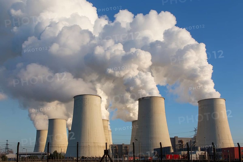 Steam rises from the cooling towers of the Vattenfall power plant in Jaenschwalde on 9 December 2014 The energy company Vattenfall extracts lignite for power generation in the surrounding opencast mines in Brandenburg, Jaenschwalde, Brandenburg, Germany, Europe