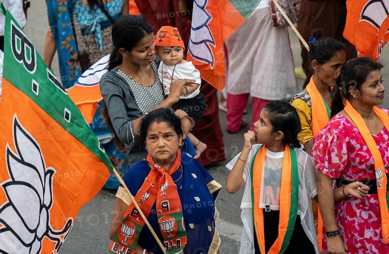 Bharatiya Janata Party (BJP) supporters arrives to to see a roadshow of Union Home minister Amit Shah, ahead of third phase of General Elections, in Guwahati, Assam, India on 29 April 2024