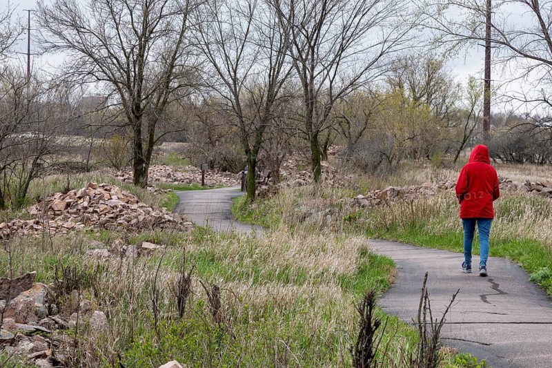 Pipestone, Minnesota, A tourist walks along a path by active quarries at Pipestone National Monument. Native Americans have quarried pipestone (Catlinite) here for hundreds of years, using it to carve the pipes used in daily life and sacred rituals