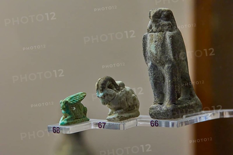 Antique statuettes in green and grey depicting various figures and animals, falcon, wild goat, interiors, Archaeological Museum, Old Town, Rhodes Town, Rhodes, Dodecanese, Greek Islands, Greece, Europe