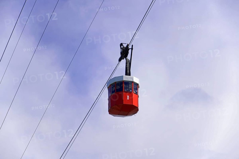 Teleferic cable car, Teleferic de Montjuic, and Torre de San Sebastia, Barcelona, Catalonia, Spain, Europe, Red cable car cabin floating in the sky, Europe