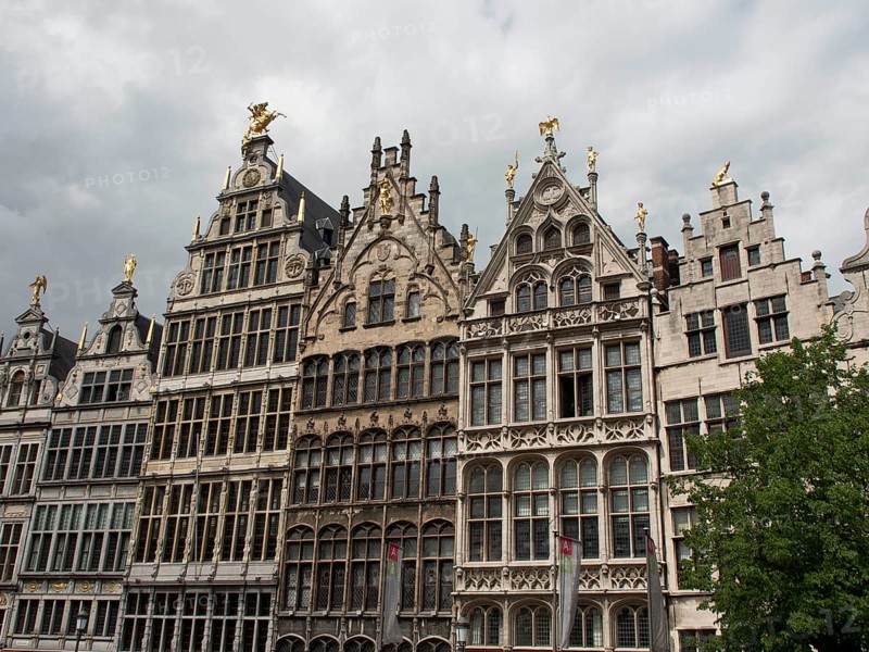 A row of ornate historic buildings with Renaissance and Baroque elements under a cloudy sky, Historic Buildings, Antwerp, Belgium, Europe