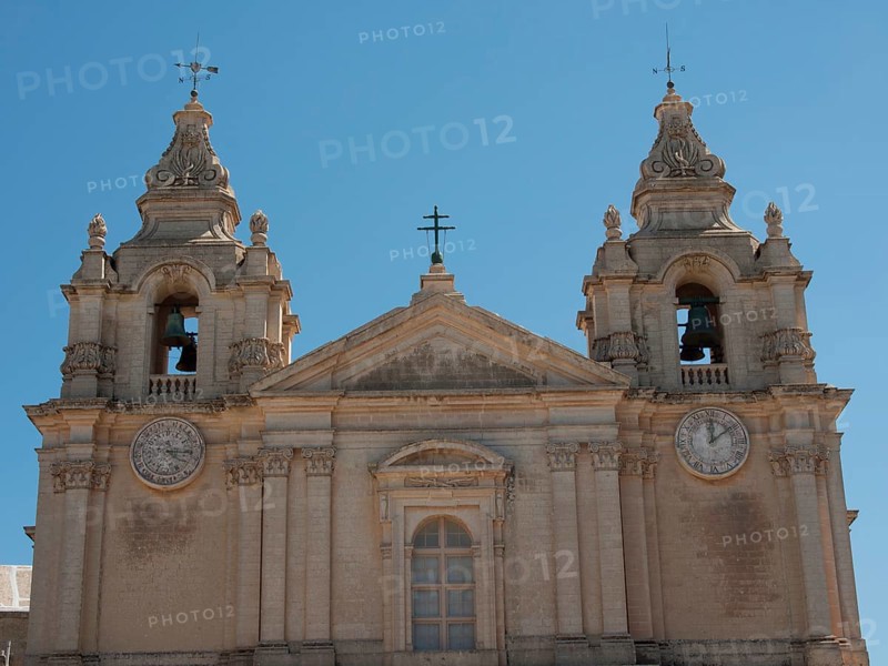 Front view of a historic church with two bell towers and clocks, the town of mdina on the island of malta with historic houses, colourful balconies, magnificent churches, mdina, Malta, Europe