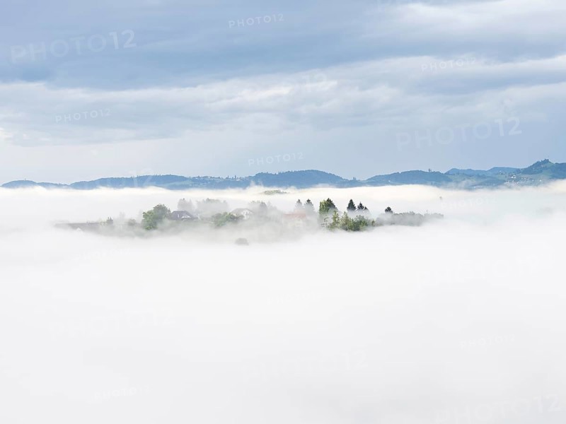 Morning fog over the village of Frauenberg, view from Silberberg, near Leibnitz, Styria, Austria, Europe