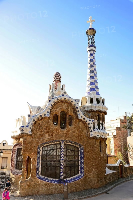 Antoni Gaudi, Park Guell, UNESCO World Heritage Site, Barcelona, Catalonia, Spain, Europe, A beautifully decorated building with numerous colourful ceramic tiles and a striking tower, Europe