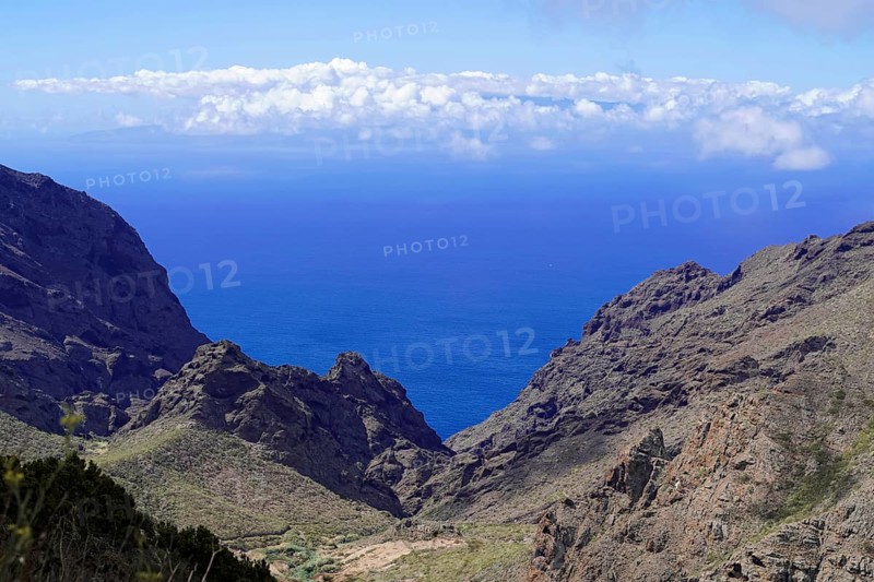 Mountain village Masca, Masca Gorge, Montana Teno Mountains, Tenerife, Canary Islands, Spain, Europe, View of the wide sea surrounded by high cliffs and a clear blue sky, Europe