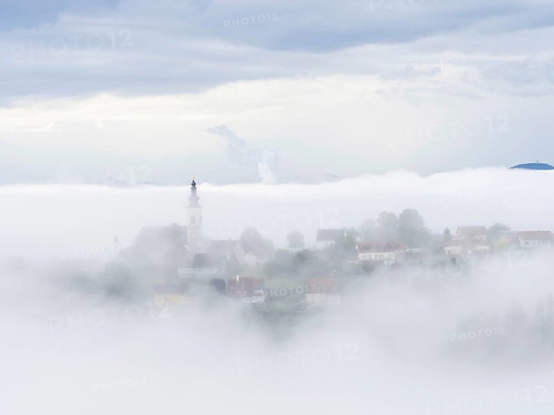 Church rises out of the morning mist, Frauenberg pilgrimage church, near Leibnitz, Styria, Austria, Europe