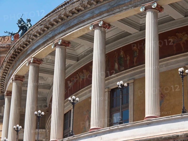 Classical architecture with columns and richly decorated facade elements, palermo in sicily with an impressive cathedral, monuments and old houses with balconies, palm trees and flowers in italy, palermo, sicily