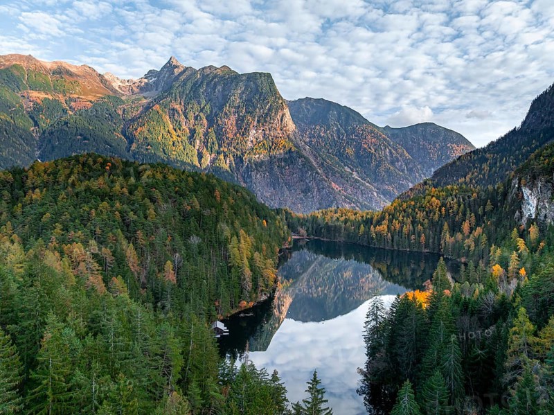 Aerial view, mountain peaks of the Oetztal Alps reflected in Lake Piburger See, in autumn, near Oetz in Oetztal, Tyrol, Austria, Europe