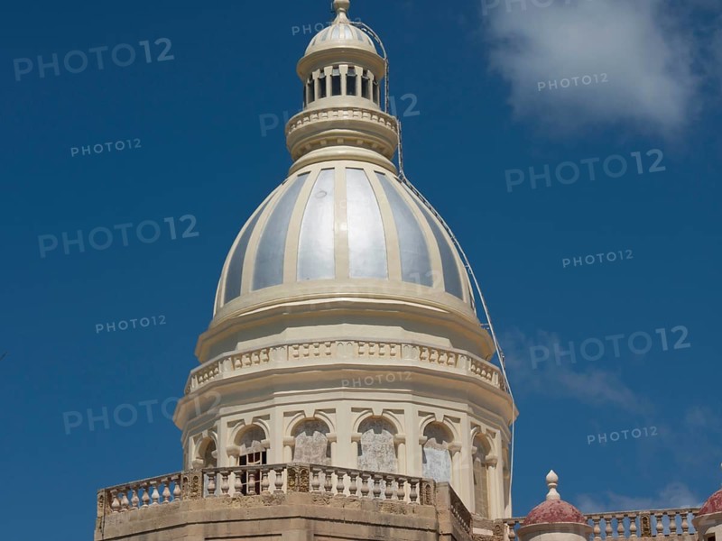 Large white-bluish dome of a religious building against a blue sky with some clouds, the island of Gozo with historic houses, colourful balconies, magnificent churches and boats in the harbour, Gozo, Malta, Europe