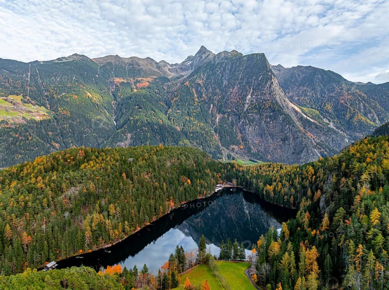 Aerial view, mountain peaks of the Oetztal Alps reflected in Lake Piburger See, in autumn, near Oetz in Oetztal, Tyrol, Austria, Europe